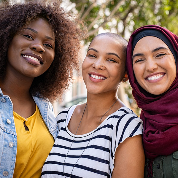 Happy women smiling with beautiful teeth