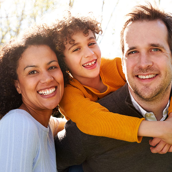 Happy family smiling having a good time outdoors